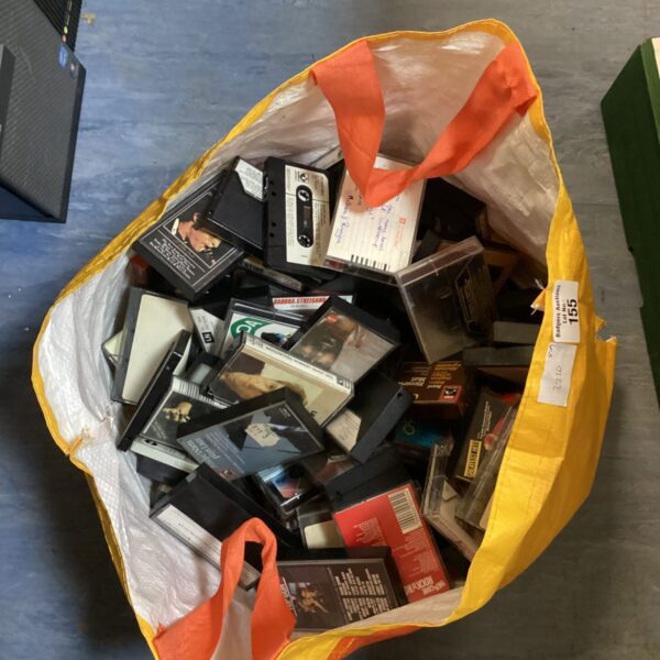 Large lot of vintage cassette tapes including Top Gun soundtrack.