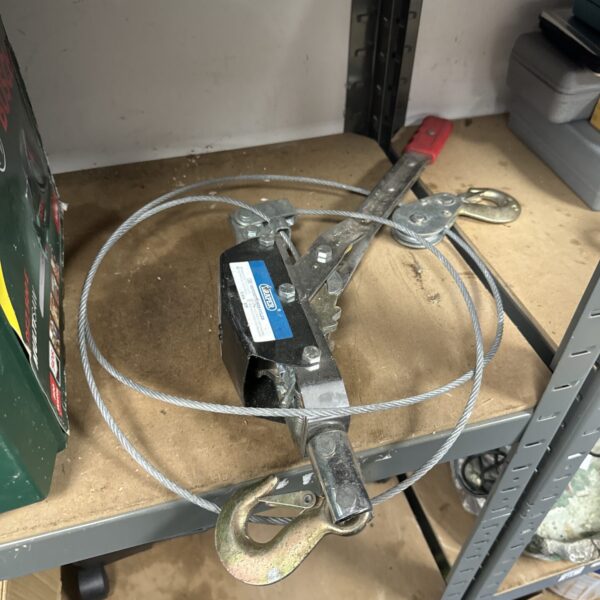 Draper ratchet winch with steel cable for lifting and securing.