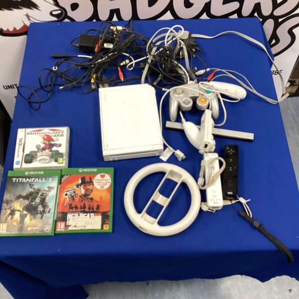 Nintendo Wii console with accessories and games bundle.