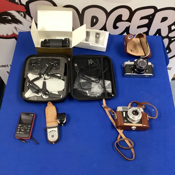Vintage camera lot with Fujifilm and Voightlander cameras and drone.