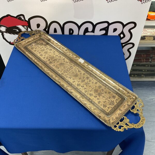 Large antique Anglo Indian brass tray with intricate embossed designs.