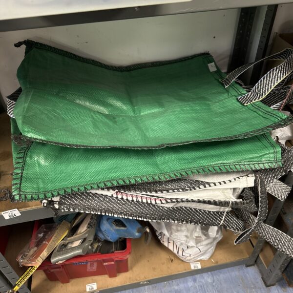 Lot of six green heavy duty sacks for storage.