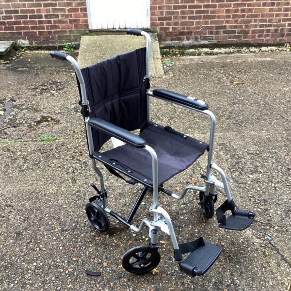 Front view of a Care Co folding wheelchair, a portable mobility aid.