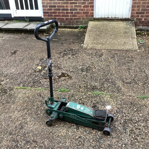 Used trolley jack in a garage setting, ideal for car maintenance.