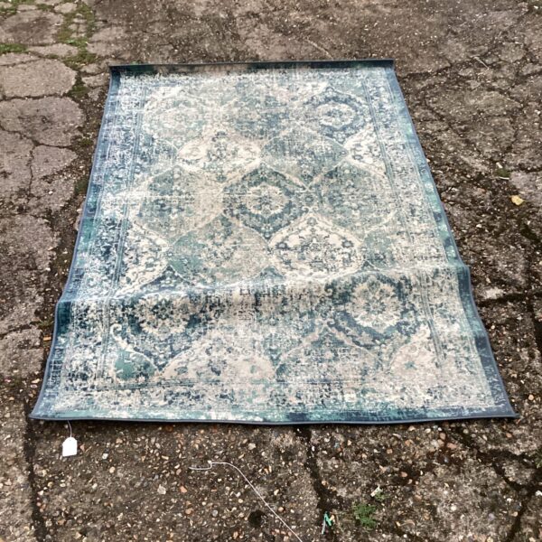 Detailed blue and cream patterned Ikea Vonsbak rug.