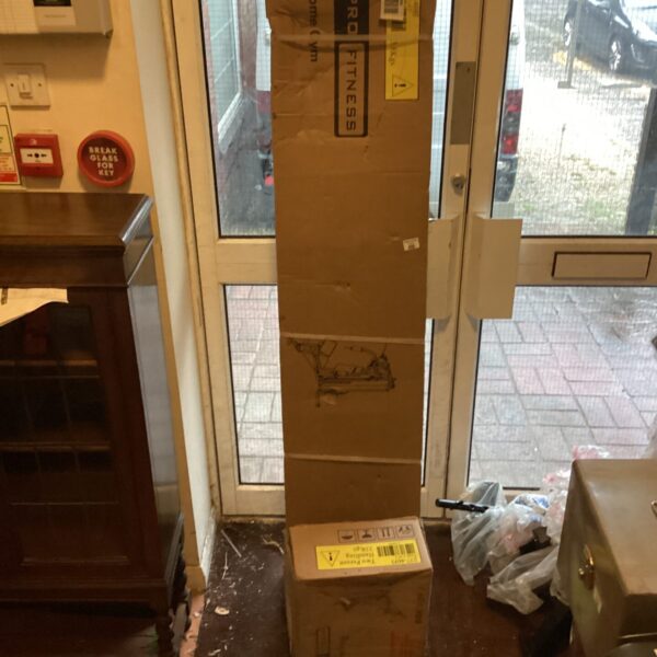 Pro Fitness exercise machine boxes for home gym setup.