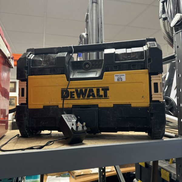 Dewalt DCR015 site radio with charger, showing wear.