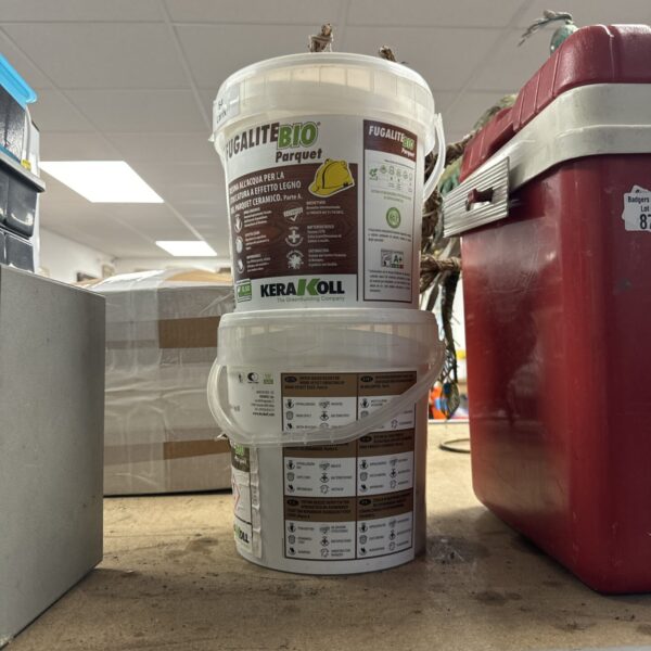 Two tubs of Fugalite Bio resin grout for wood effect tiling.