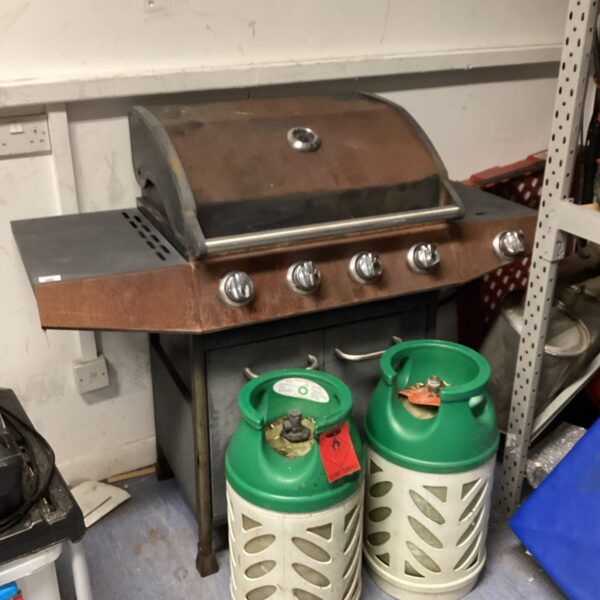 Portable gas BBQ grill with two lightweight gas bottles.