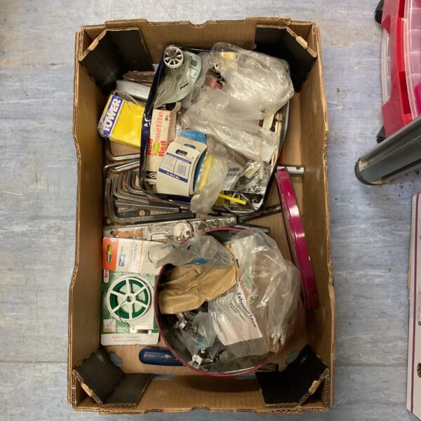 Mixed hardware lot with nails, fittings, and allen keys for DIY projects.