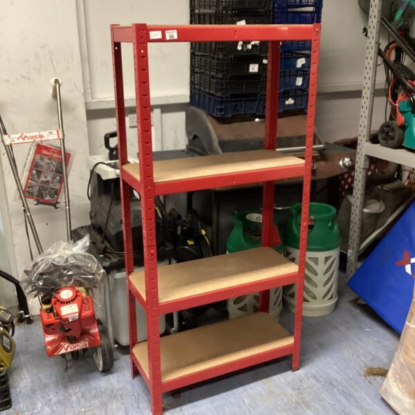 Red metal shelving unit for garage or workshop storage.