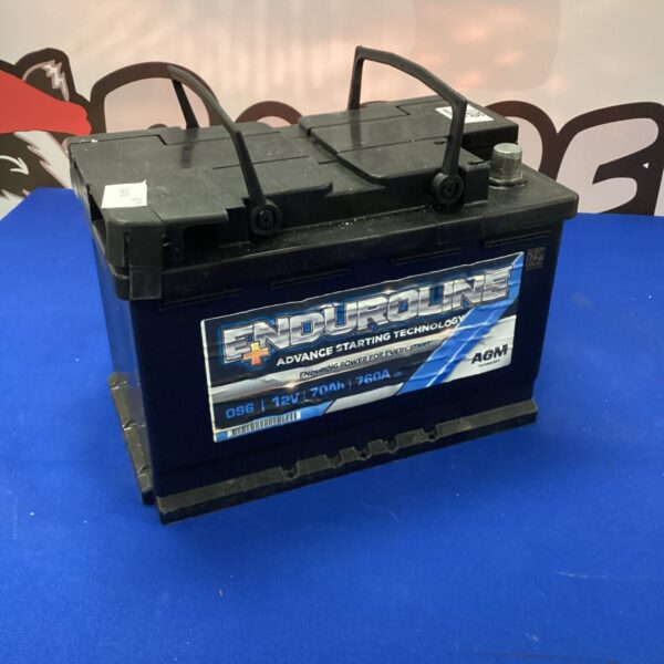 Side view of an Enduroline 12V car battery for automotive use.