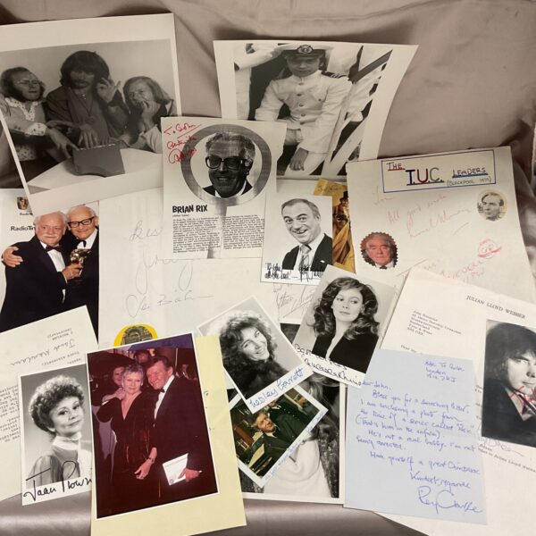Group photo of signed autographs from British political and entertainment figures.