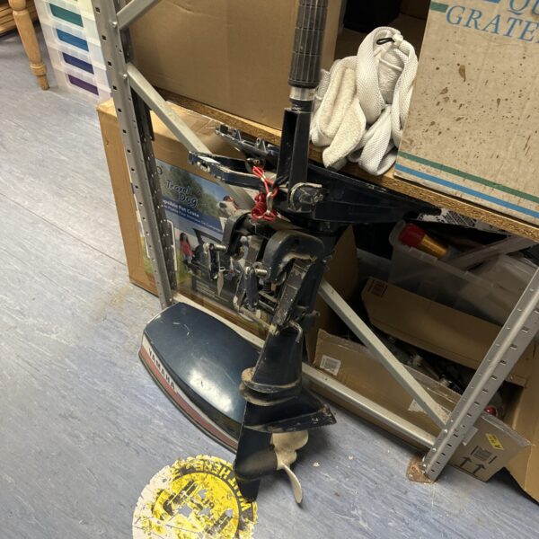 Vintage Yamaha 8 outboard motor assembly for boat repair.
