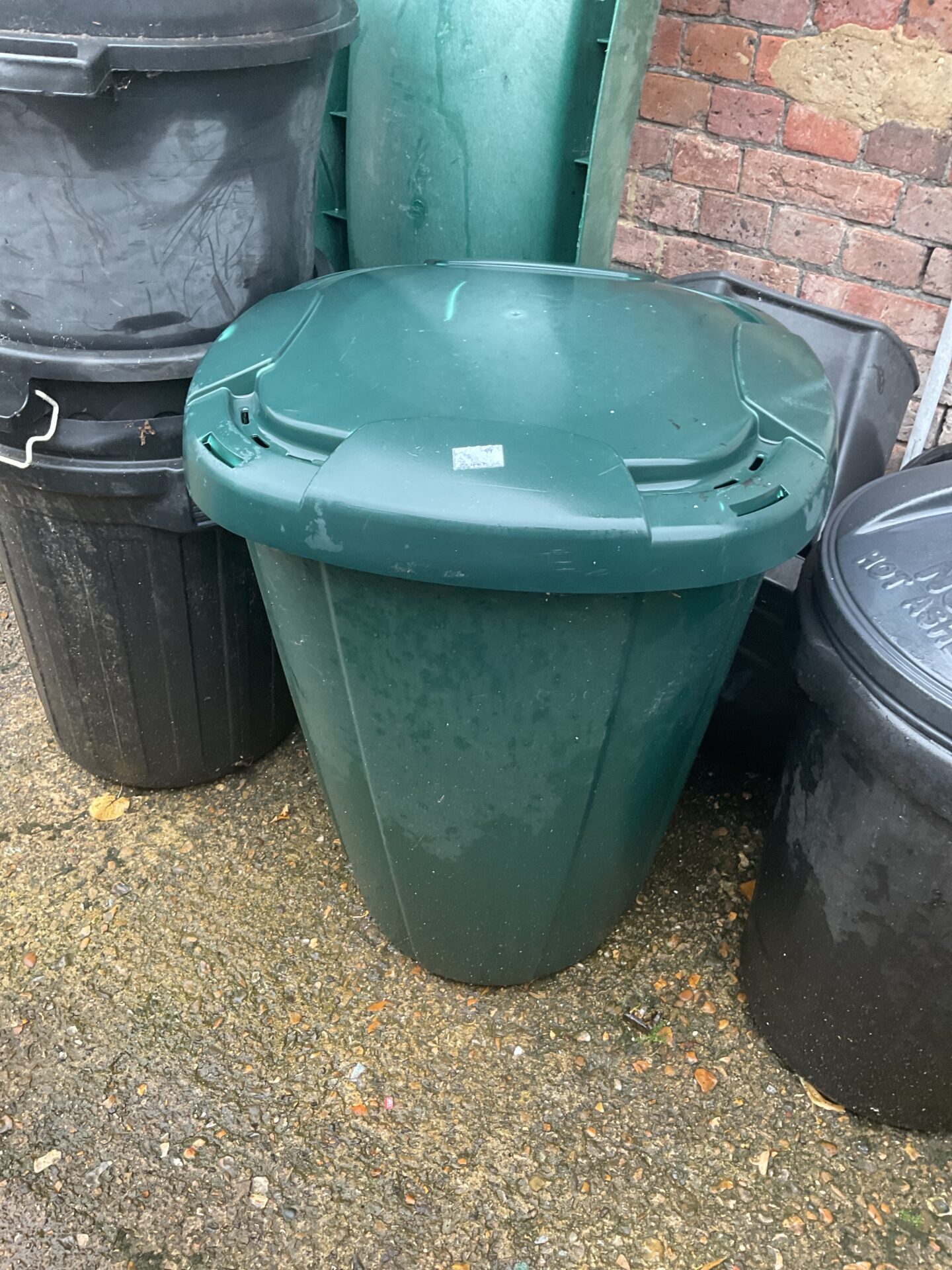 1027 Green plastic trash bin