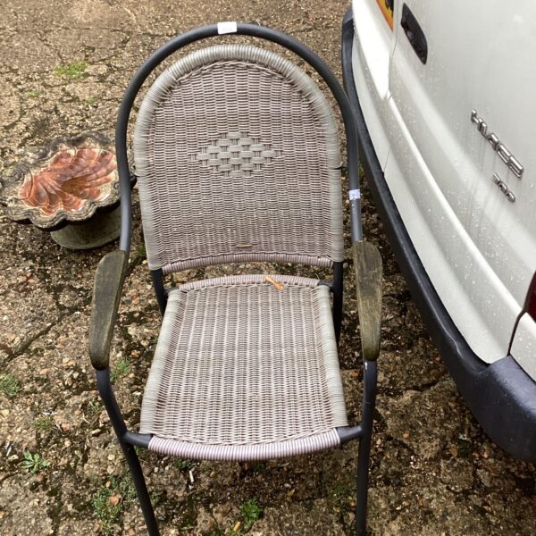 Rattan effect garden chair with a classic design.