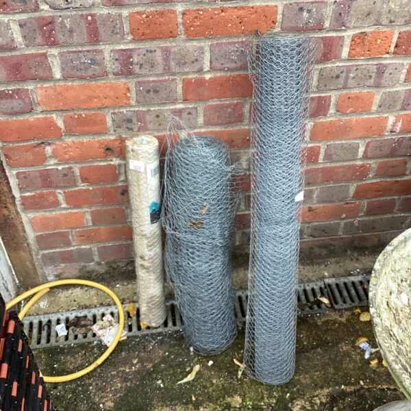 Galvanized chicken wire rolls for garden and poultry use.