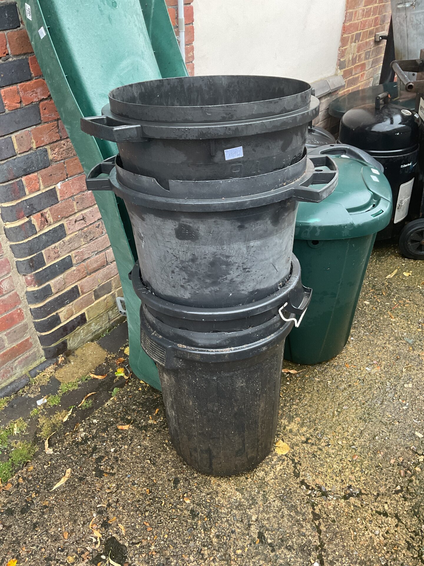 1029 Stack of four black plastic bins