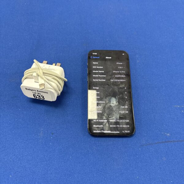 Apple iPhone 12 Pro smartphone with charger.