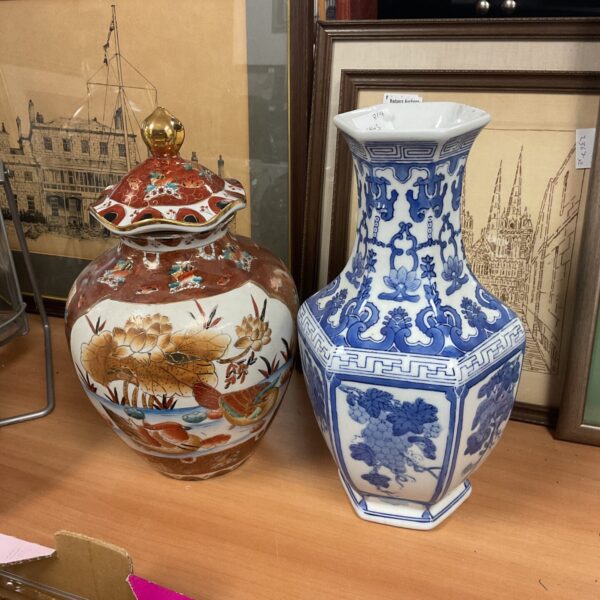 Vibrant red and gold Chinese porcelain vase with floral design.