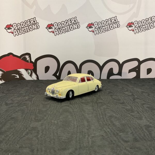 Detailed Burago Jaguar MK2 diecast model car on display.