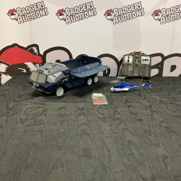 Remote control heli-mission truck with helicopter, collectible toy.