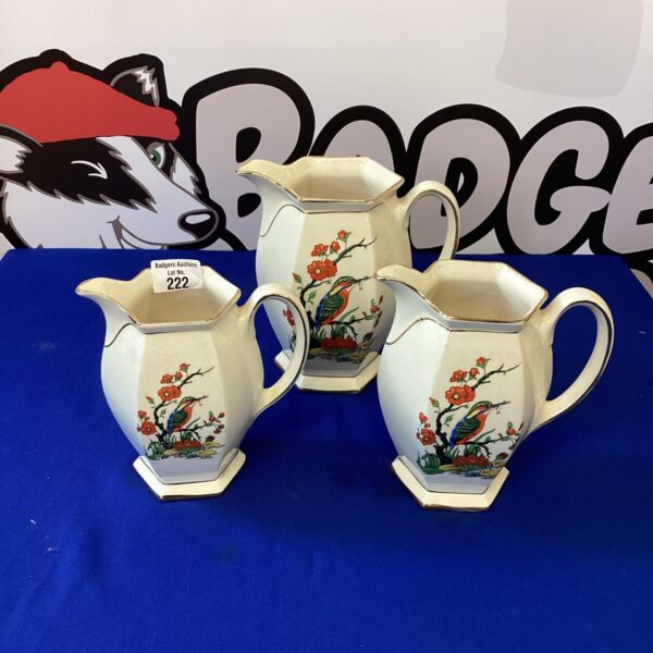 Three vintage Arthur Wood porcelain jugs with bird designs.