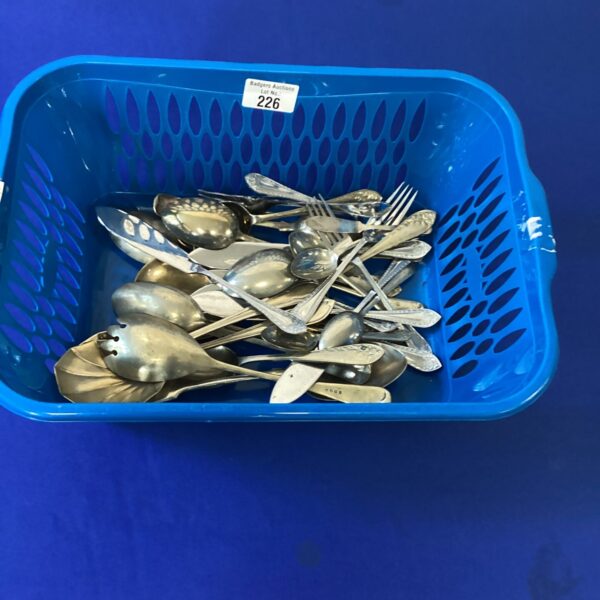 Vintage silverplate cutlery set with mixed patterns and designs.