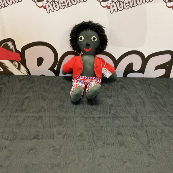 Vintage Sheila Kmallim Polly doll in red jacket.