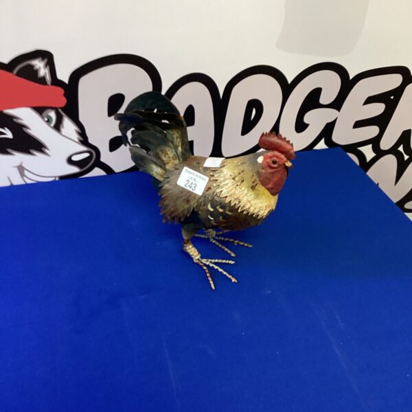 Vintage metal cockerel figurine, detailed farm animal sculpture.