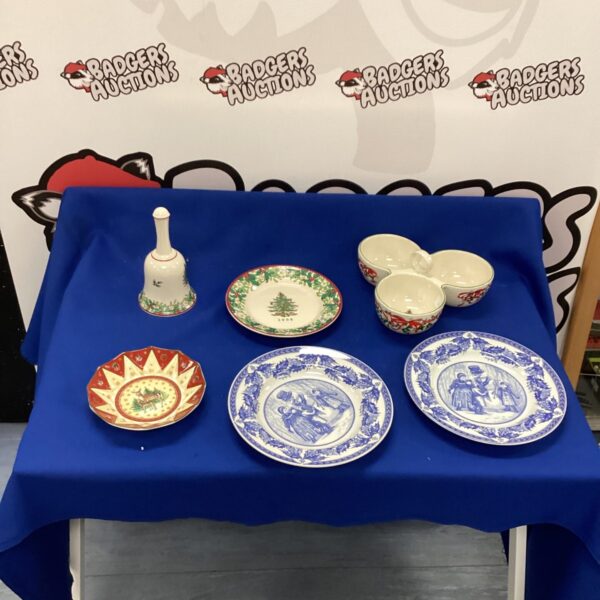 Festive Christmas tableware set with plates and bowls.
