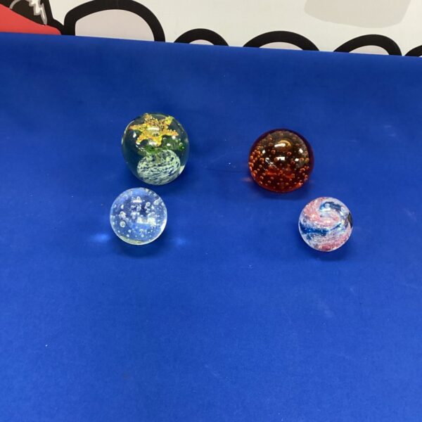 Four Glass Paperweights