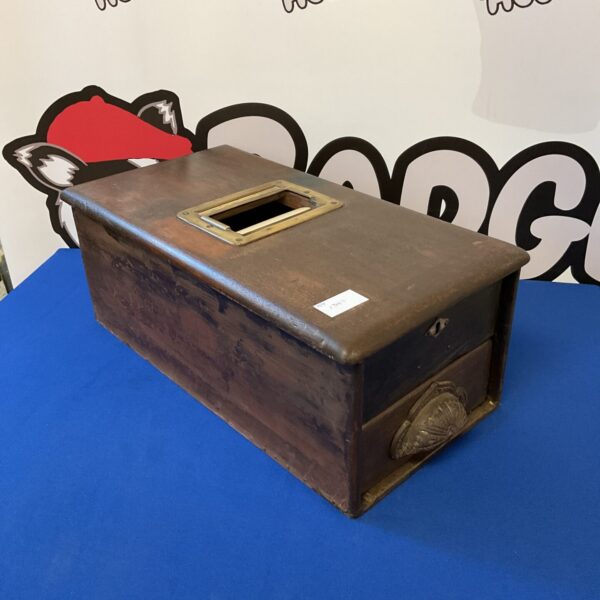 Front view of antique cash register with keys and display.