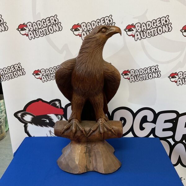 Large carved wooden eagle statue, detailed folk art sculpture.