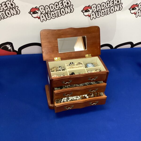 Vintage wooden jewellery box with contents, a collectable storage solution.