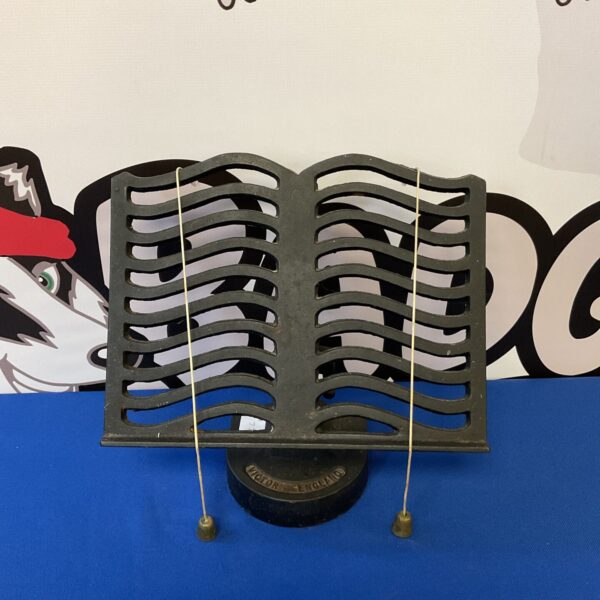 Antique Victor cast iron recipe book stand for vintage cookbooks.