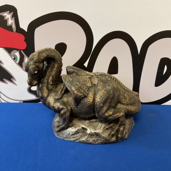 Dark metallic dragon candle holder for gothic decor.