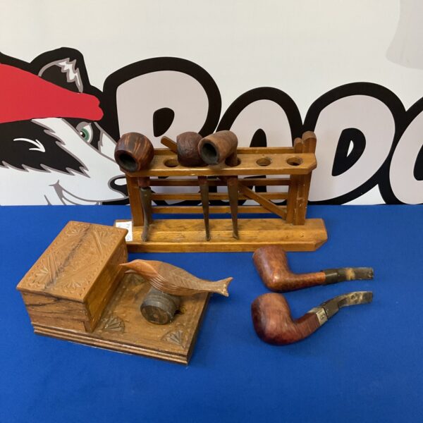 Vintage wooden pipe rack and bird cigarette box for collectors.