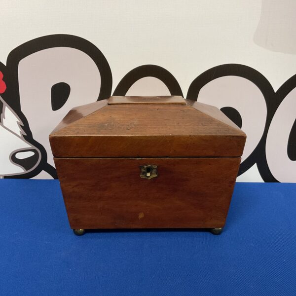 Front view of antique mahogany tea caddy with lift-top lid.