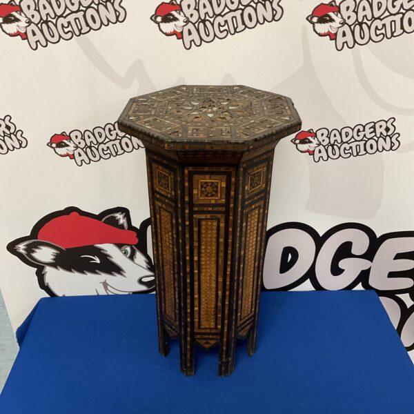 Antique Moorish lamp table with inlaid geometric patterns.