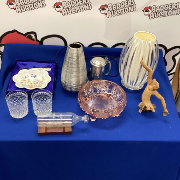 Mixed lot of vintage collectibles including glassware and carved monkey.