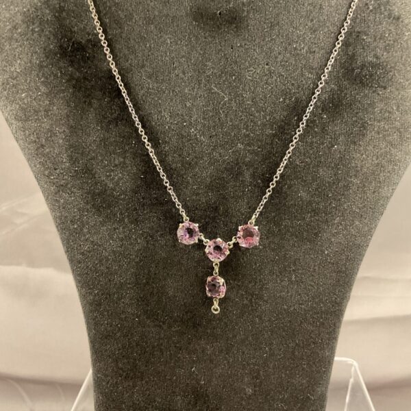 Silver amethyst necklace with four stone pendant.