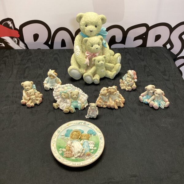 Collection of Priscilla Hillman Cherished Teddies ornaments displayed together.