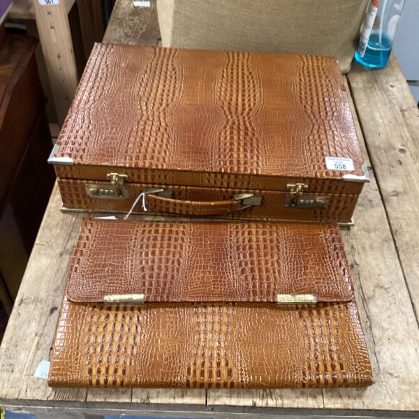 Vintage crocodile-style briefcase with textured exterior.