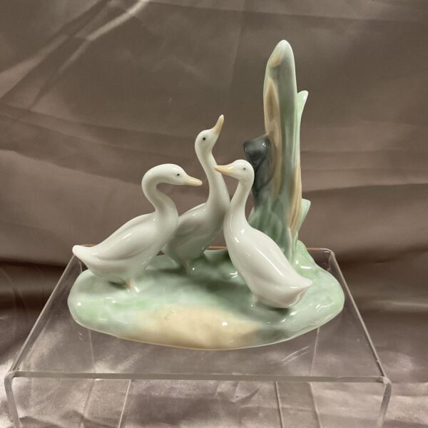 Delicate Lladro porcelain geese figurine, detailed animal sculpture.