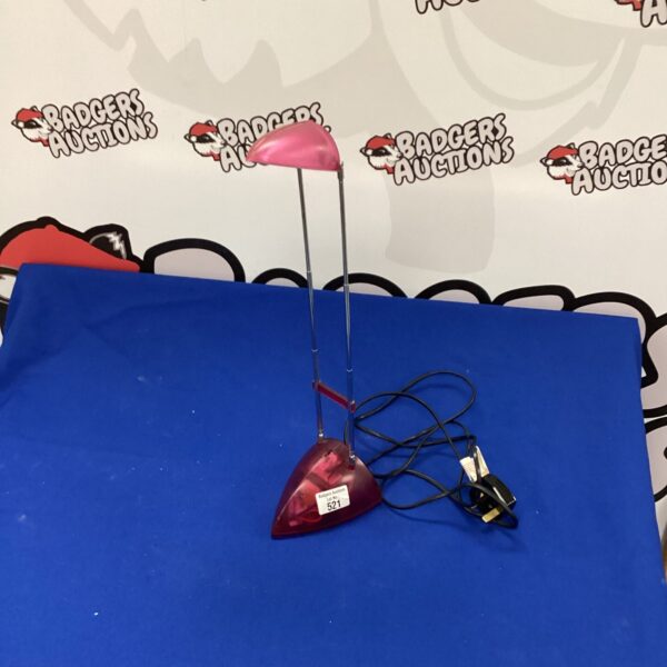 Vintage pink telescopic reading lamp with adjustable neck.