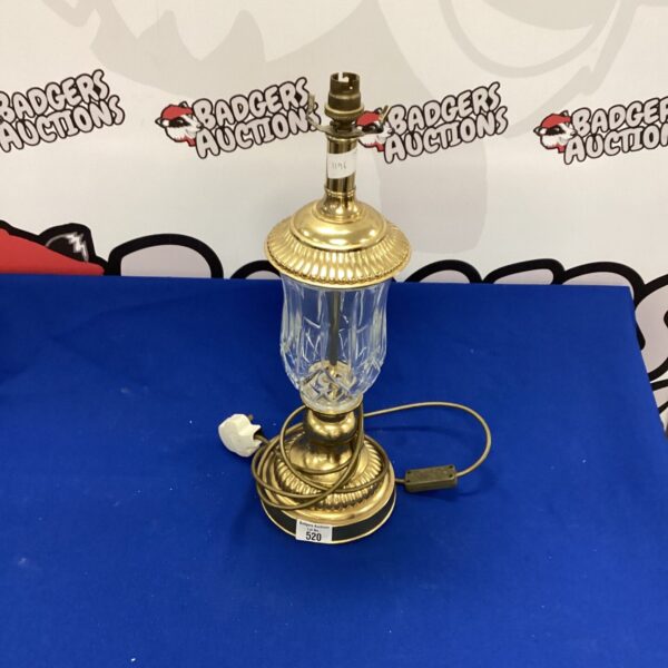 Vintage brass and glass table lamp with a clear shade.