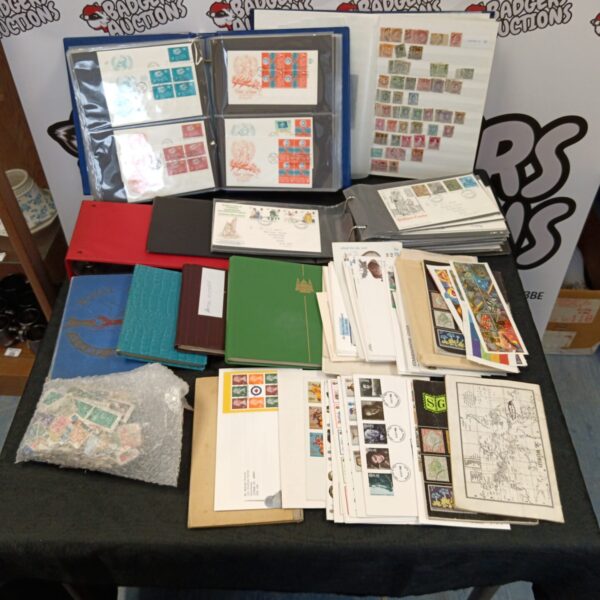 Vintage stamp collection albums and first day covers for collectors.