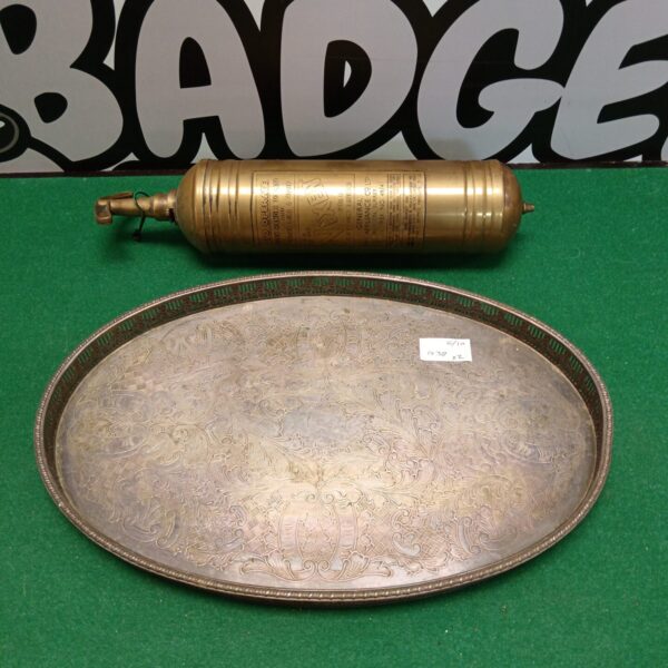Vintage silver plate tray with embossed floral design for serving.