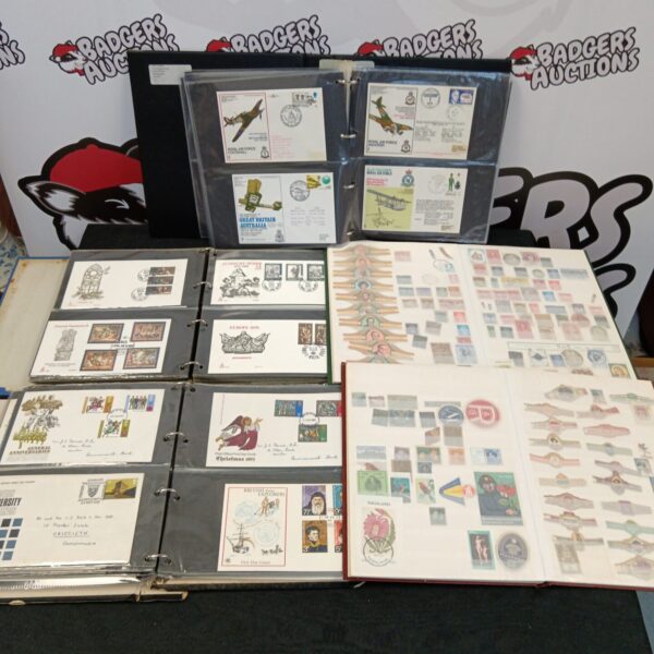 First day covers and stamp collection within protective albums.
